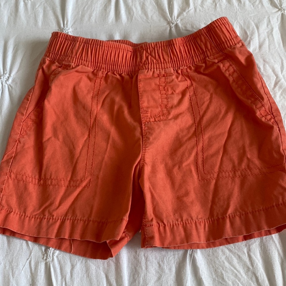 Infant orange shorts.